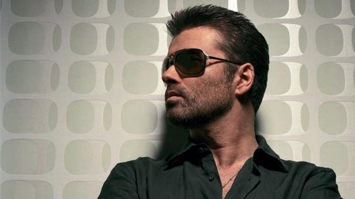 George Michael wearing dark sun glasses