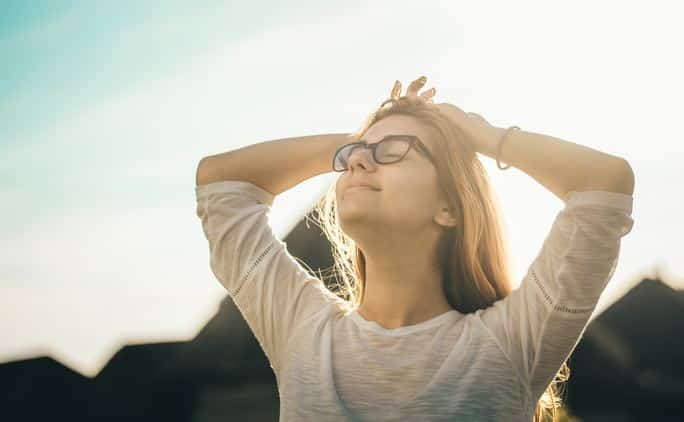 a female with a happy face after going through depression retreat.