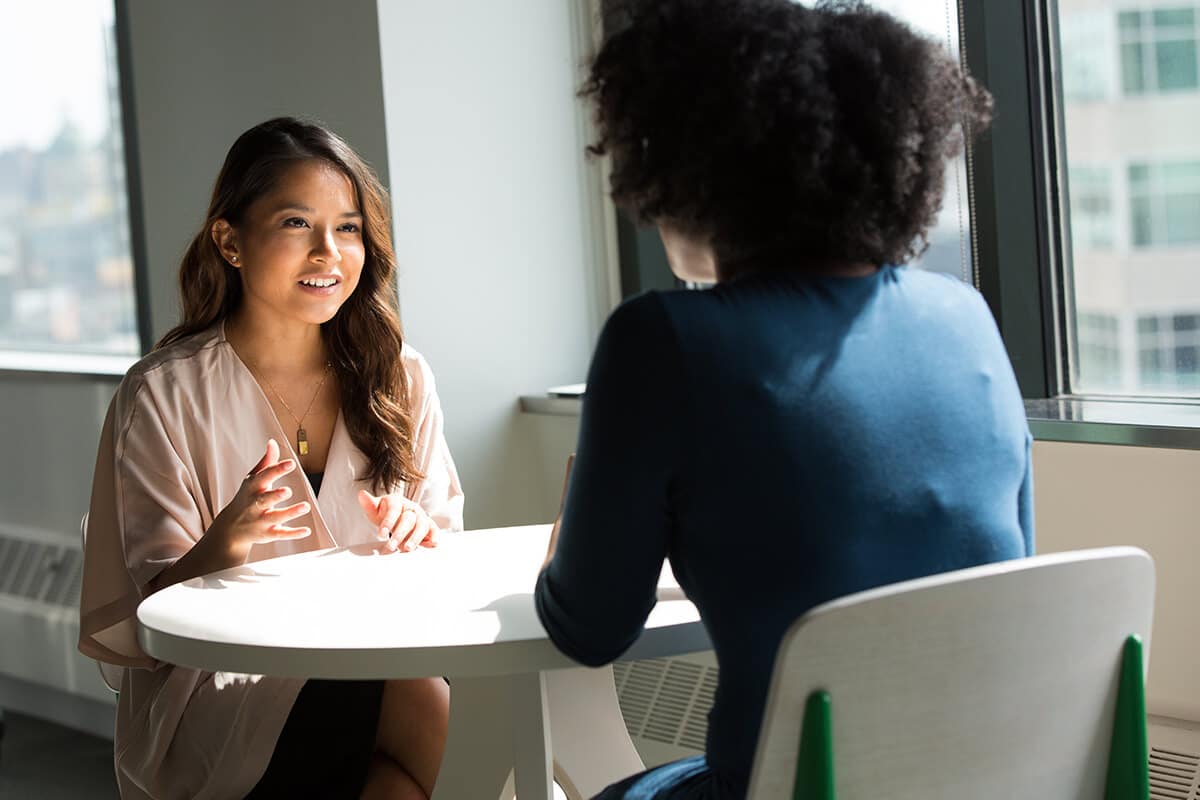 the girl is having a weekly consultation appointment with her outpatient psychotherapist.