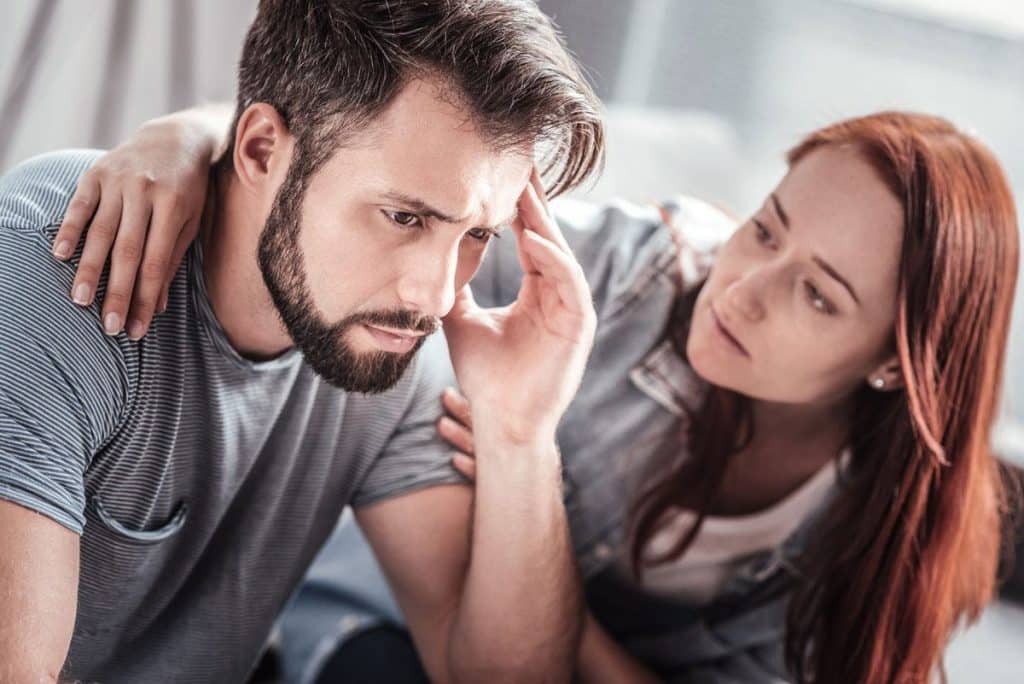 woman supporting her loved one who is confronting a relapse.