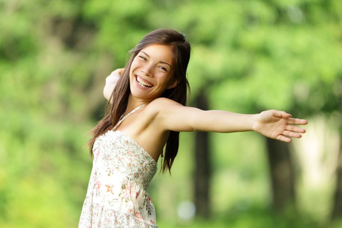 A woman feels free and delighted after going through the treatment to solve her childhood trauma at The Dawn Wellness Centre and Rehab Thailand.