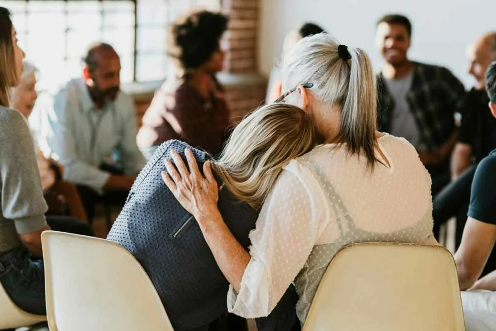 People support each other in a rehab session