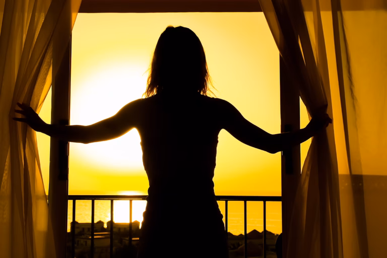 silhouette girl balcony background - Depression Rehab: Can You Go to Rehab for Depression?
